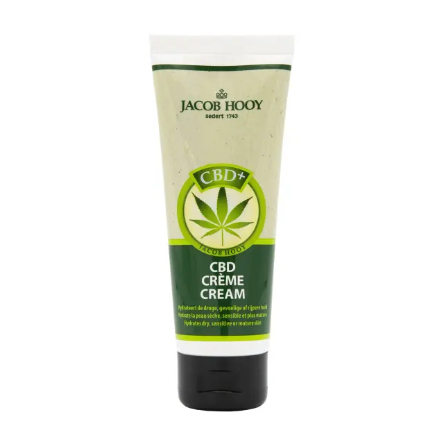 een tube cbd-crème op een witte achtergrond.